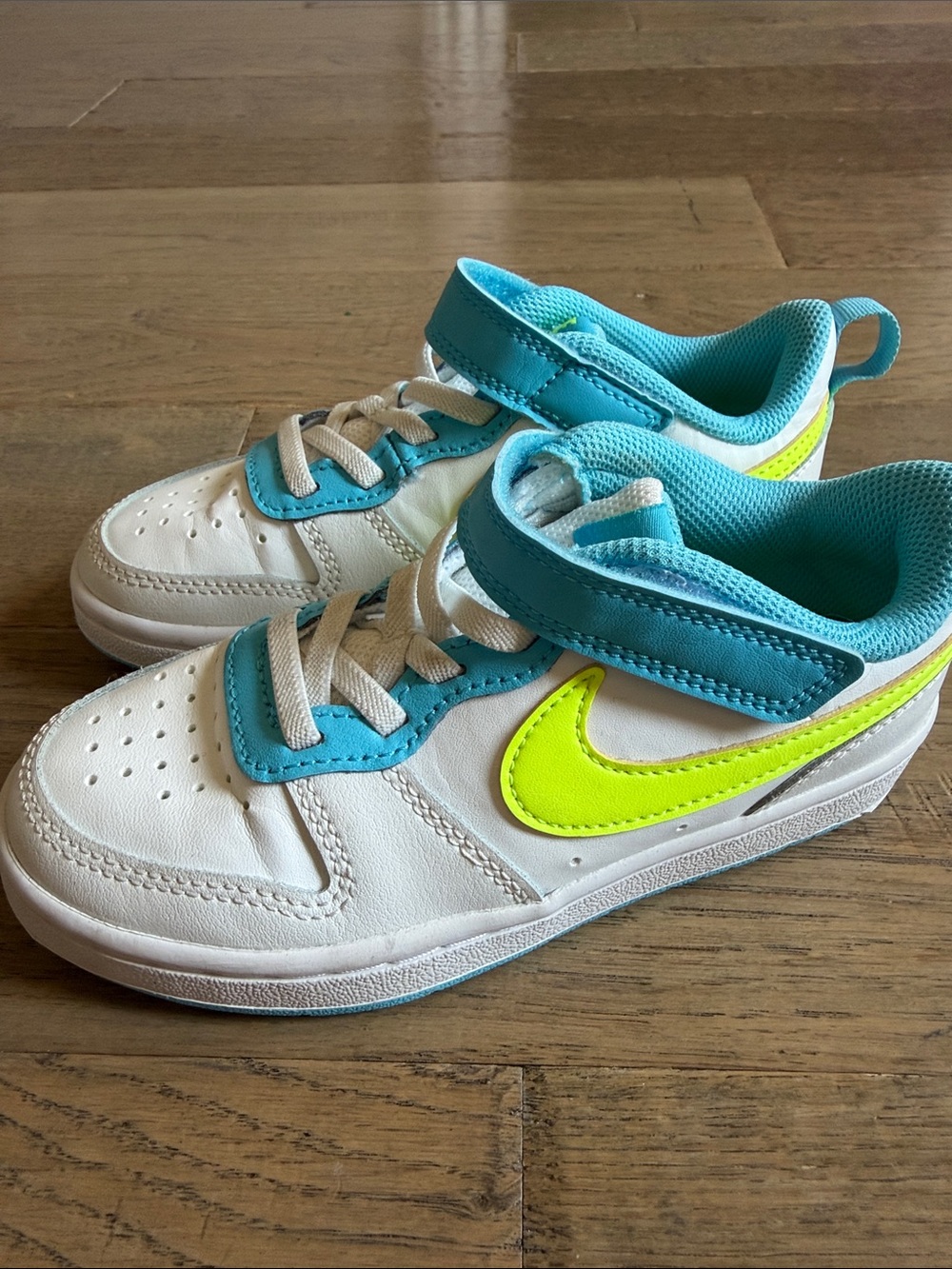 Nike Kids White Sneakers with Teal and Neon Yellow Accents Size 12C